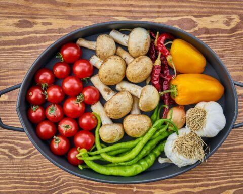 assorted spices in casserole on brown wooden table