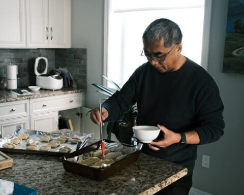 focused man cooking in kitchen