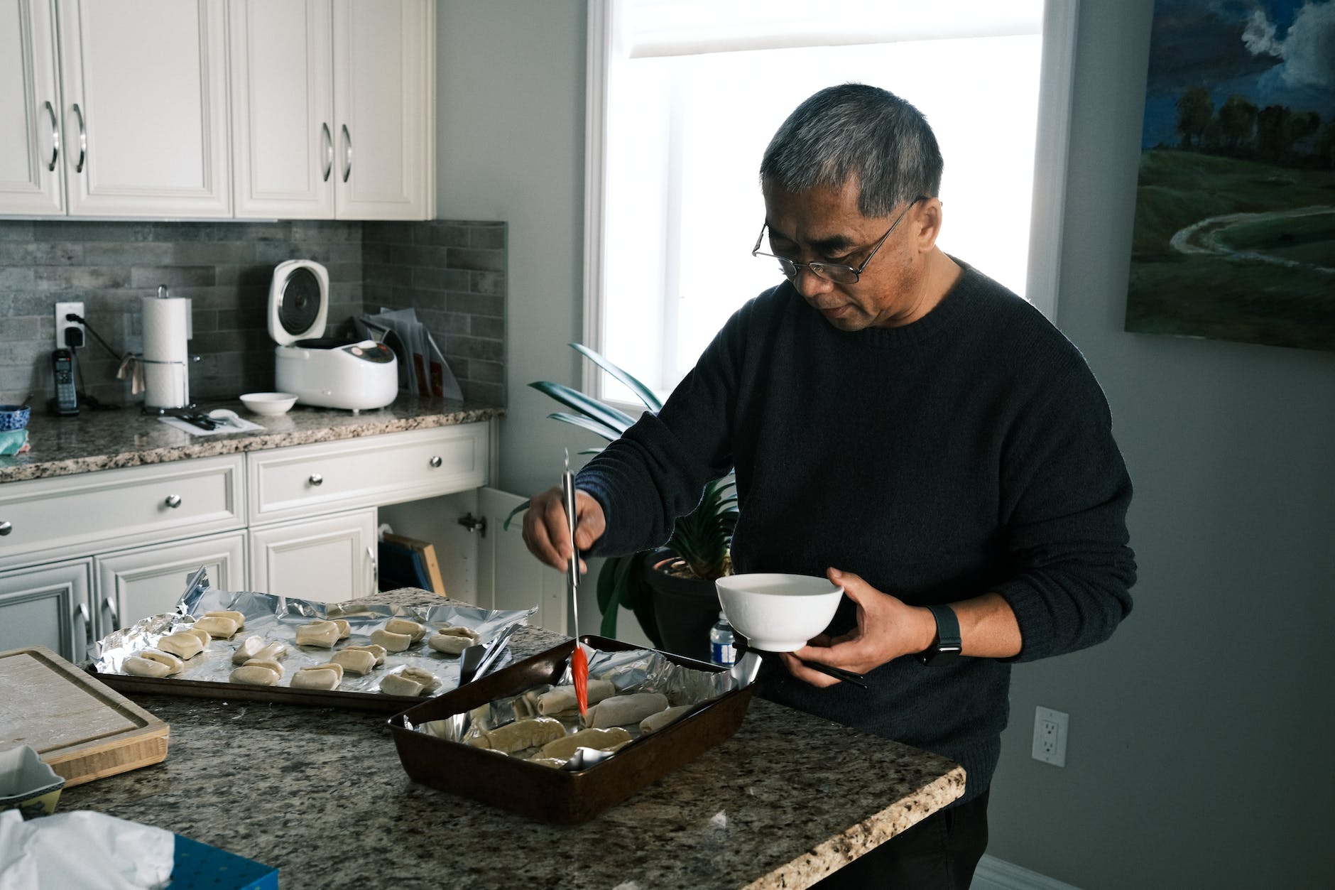 focused man cooking in kitchen