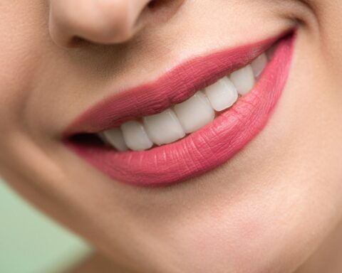 woman with red lipstick smiling