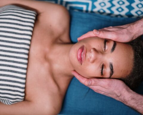 woman lying on blue textile